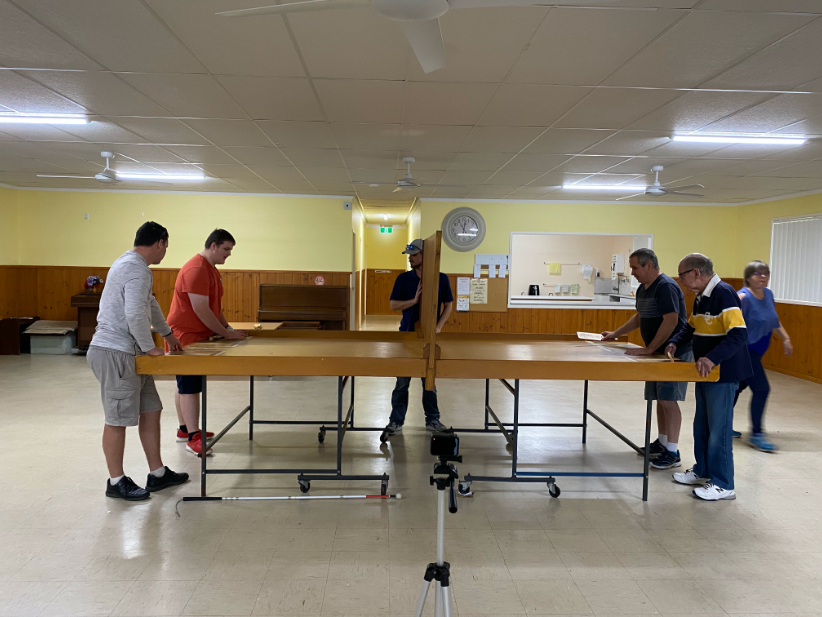 Four people around a swish table with umpire in the middle